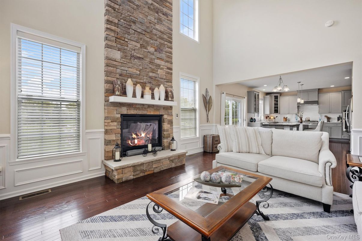 Fireplace, Interior, Kitchen, Living room, Pendant Lights, Recessed Lighting, Stainless Steel Appliances, Stone Walls, Wood Texture Flooring