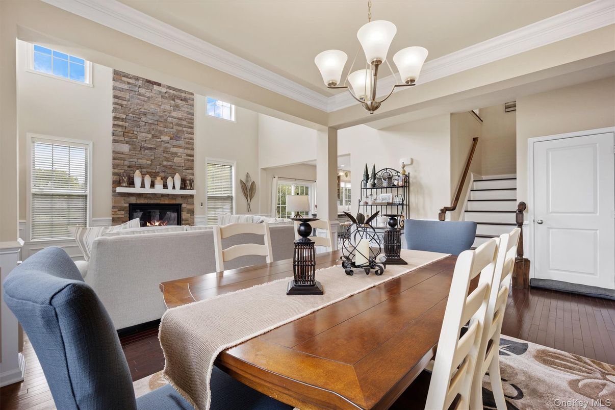 Chandelier, Dining room, Fireplace, Interior, Living room, Stone Walls, Wood Texture Flooring