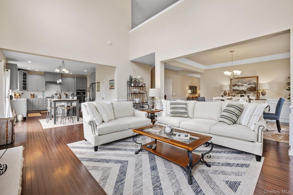 Chandelier, Dining room, Interior, Kitchen, Living room, Pendant Lights, Recessed Lighting, Stainless Steel Appliances, Wood Texture Flooring