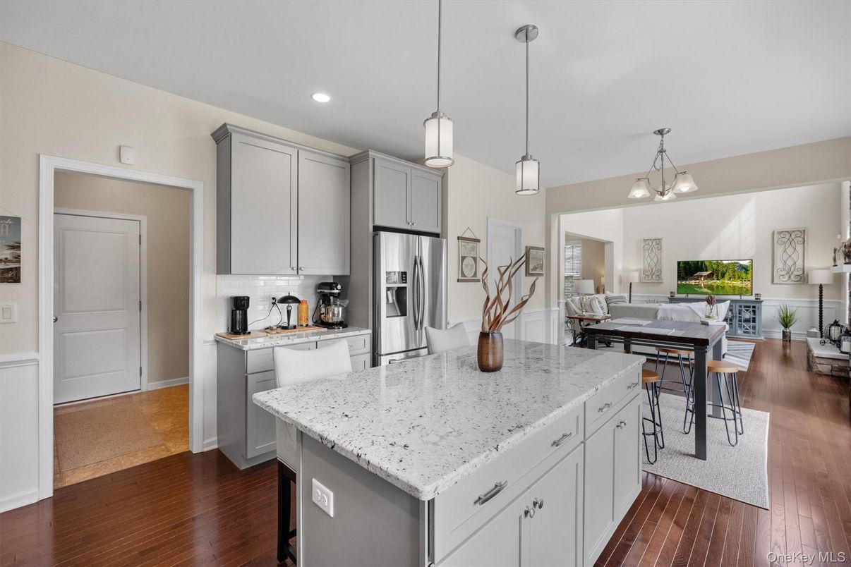 Dining room, Interior, Kitchen, Pendant Lights, Recessed Lighting, Stainless Steel Appliances, Wood Texture Flooring