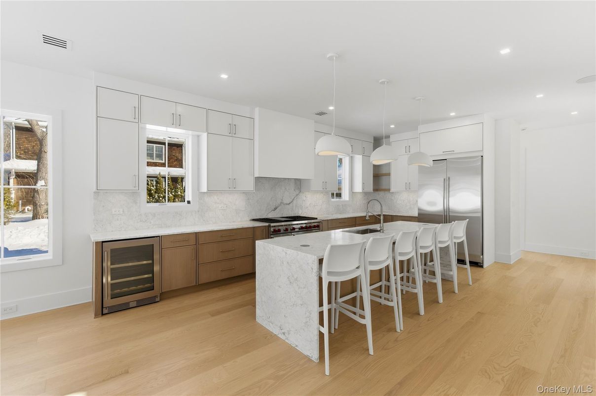 Interior, Kitchen, Marble Walls, Pendant Lights, Recessed Lighting, Stainless Steel Appliances, Wood Texture Flooring