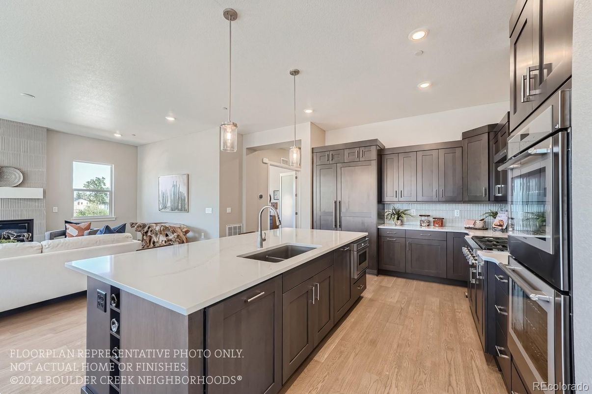 Fireplace, Interior, Kitchen, Living room, Pendant Lights, Recessed Lighting, Stainless Steel Appliances, Wood Texture Flooring