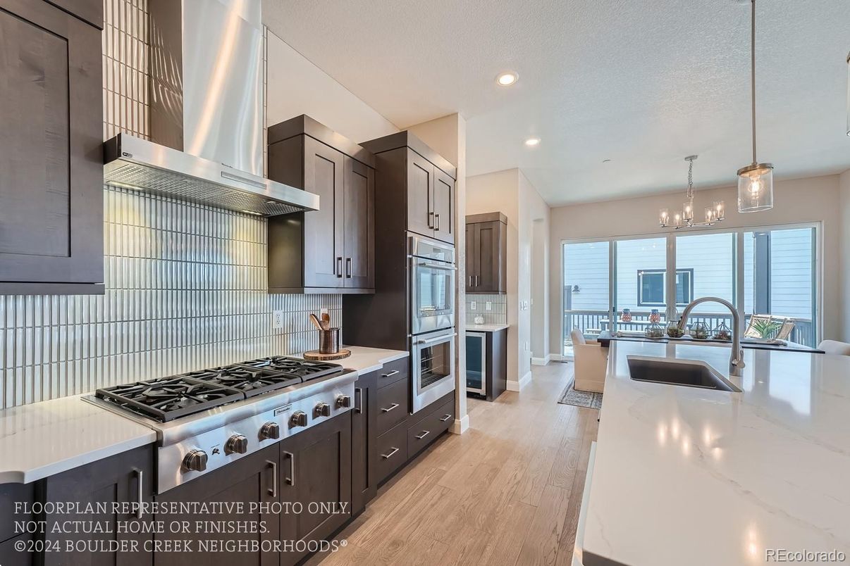 Chandelier, Interior, Kitchen, Pendant Lights, Recessed Lighting, Stainless Steel Appliances, Wood Texture Flooring