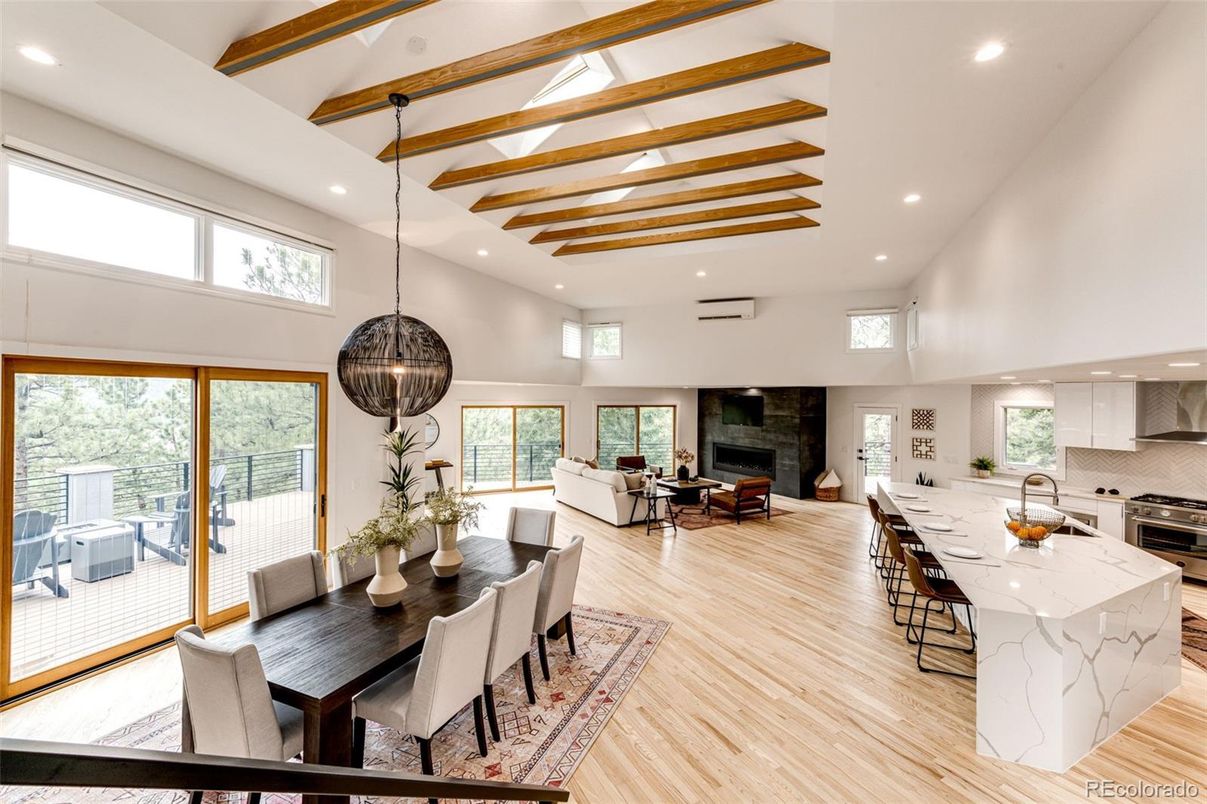 Dining room, Fireplace, Interior, Kitchen, Living room, Pendant Lights, Recessed Lighting, Stainless Steel Appliances, Wood Texture Flooring