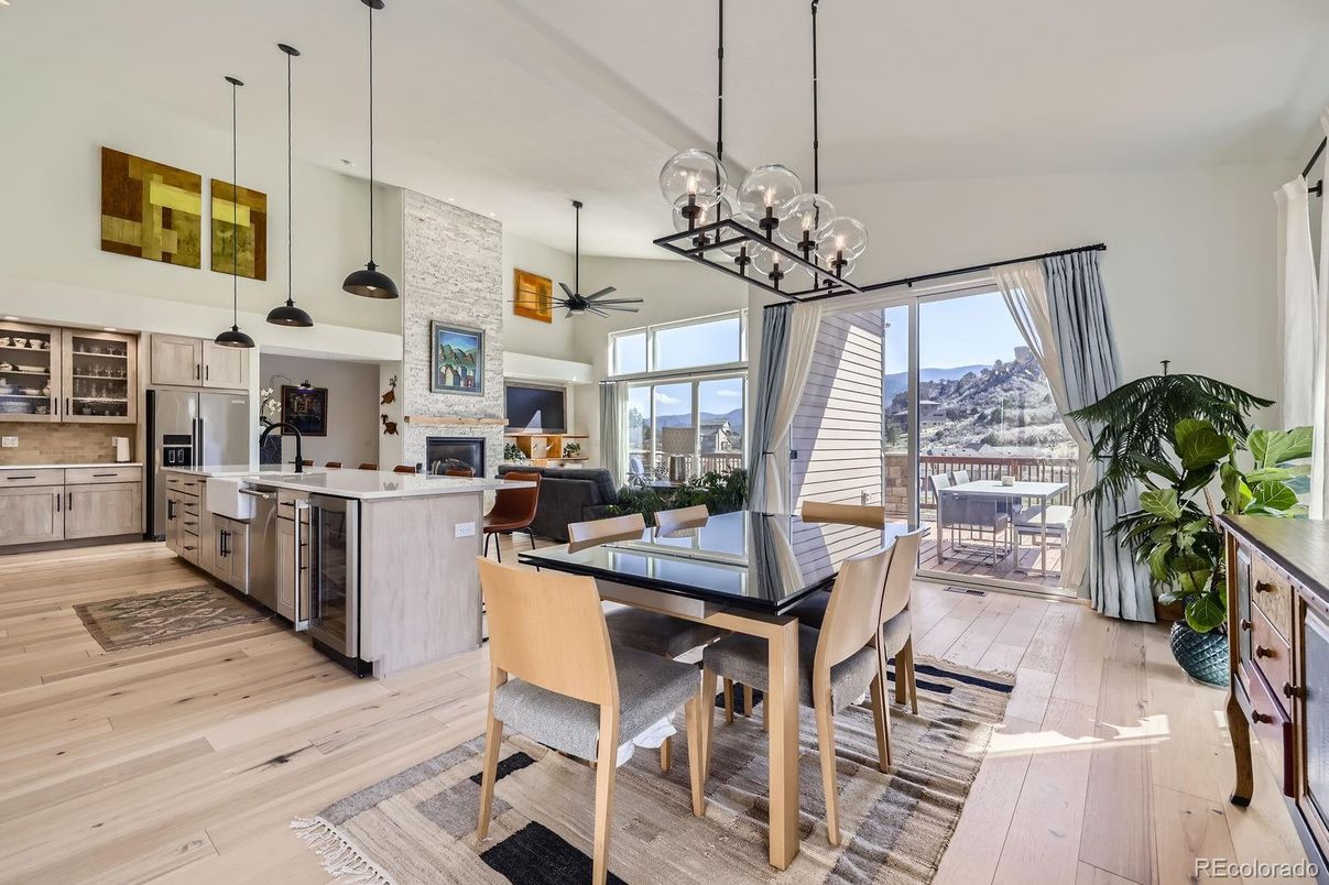 Dining room, Fireplace, Interior, Kitchen, Living room, Pendant Lights, Stainless Steel Appliances, Wood Texture Flooring