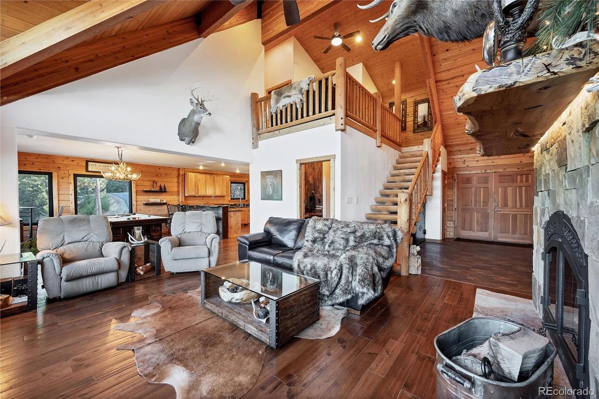 Chandelier, Dining room, Fireplace, Interior, Kitchen, Living room, Recessed Lighting, Wooden Beams, Wooden Ceilings, Wood Texture Flooring