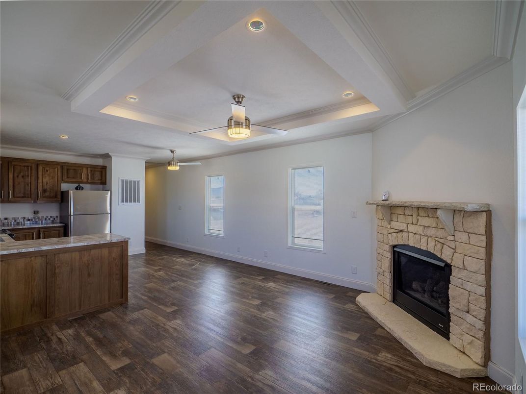 Empty room, Fireplace, Interior, Kitchen, Recessed Lighting, Wood Texture Flooring