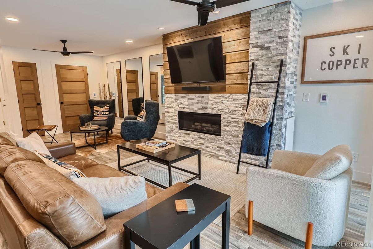 Fireplace, Interior, Living room, Recessed Lighting, Stone Walls, Wood Texture Flooring