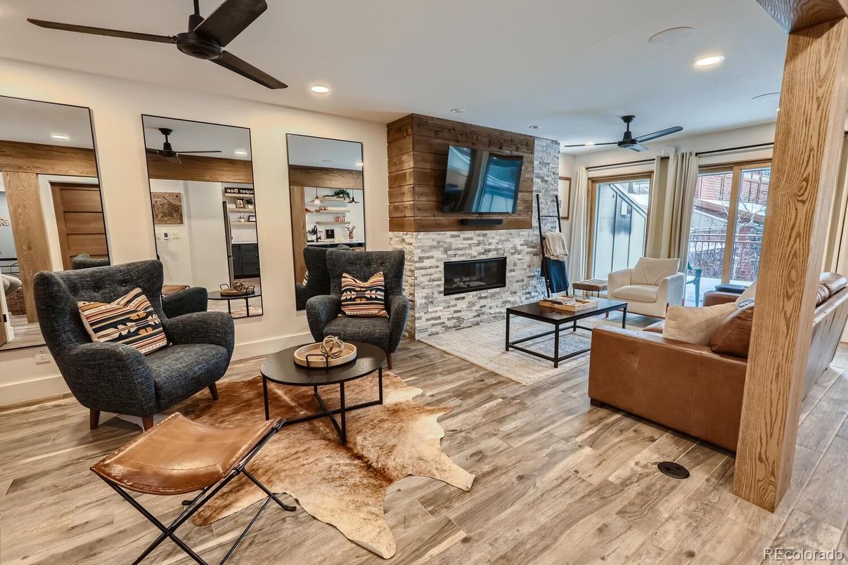 Fireplace, Interior, Living room, Recessed Lighting, Stone Walls, Wood Texture Flooring, Wooden Walls