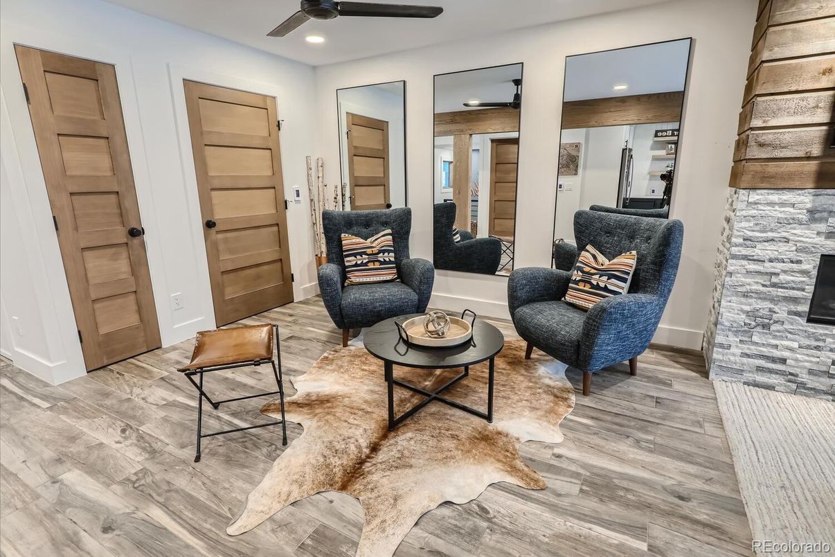 Fireplace, Interior, Living room, Recessed Lighting, Stone Walls, Wood Texture Flooring