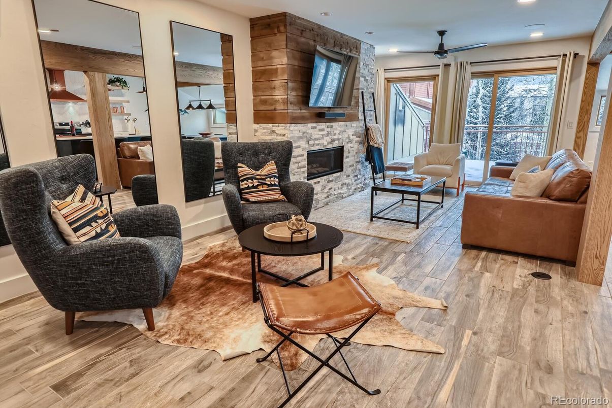 Fireplace, Interior, Living room, Recessed Lighting, Stone Walls, Wood Texture Flooring, Wooden Walls