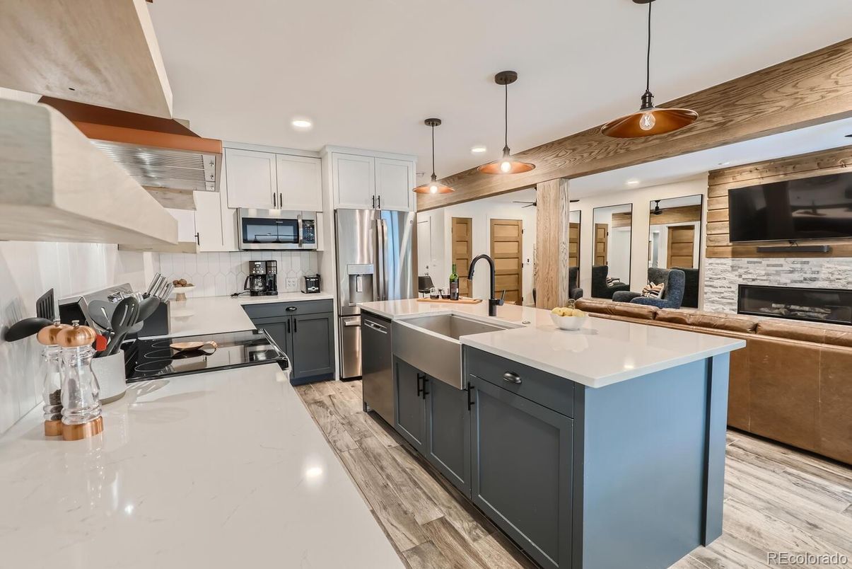 Fireplace, Interior, Kitchen, Pendant Lights, Recessed Lighting, Stainless Steel Appliances, Wood Texture Flooring