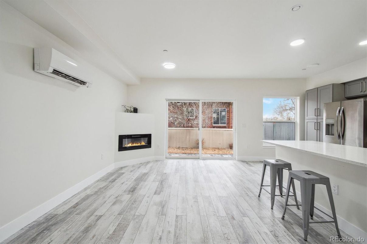 Fireplace, Interior, Kitchen, Recessed Lighting, Stainless Steel Appliances, Wood Texture Flooring