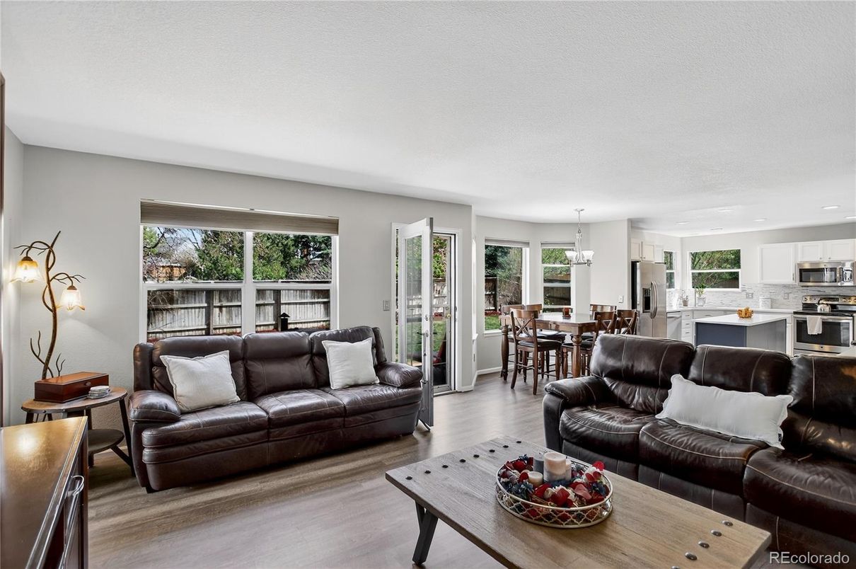 Chandelier, Dining room, Interior, Kitchen, Living room, Recessed Lighting, Stainless Steel Appliances, Wood Texture Flooring