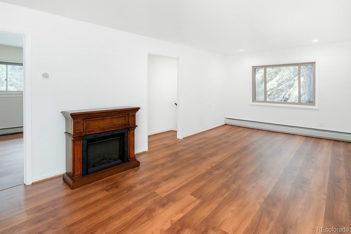 Empty room, Fireplace, Interior, Recessed Lighting, Wood Texture Flooring