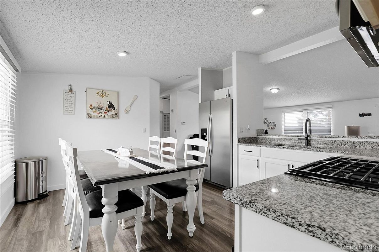 Dining room, Interior, Kitchen, Recessed Lighting, Stainless Steel Appliances, Wood Texture Flooring