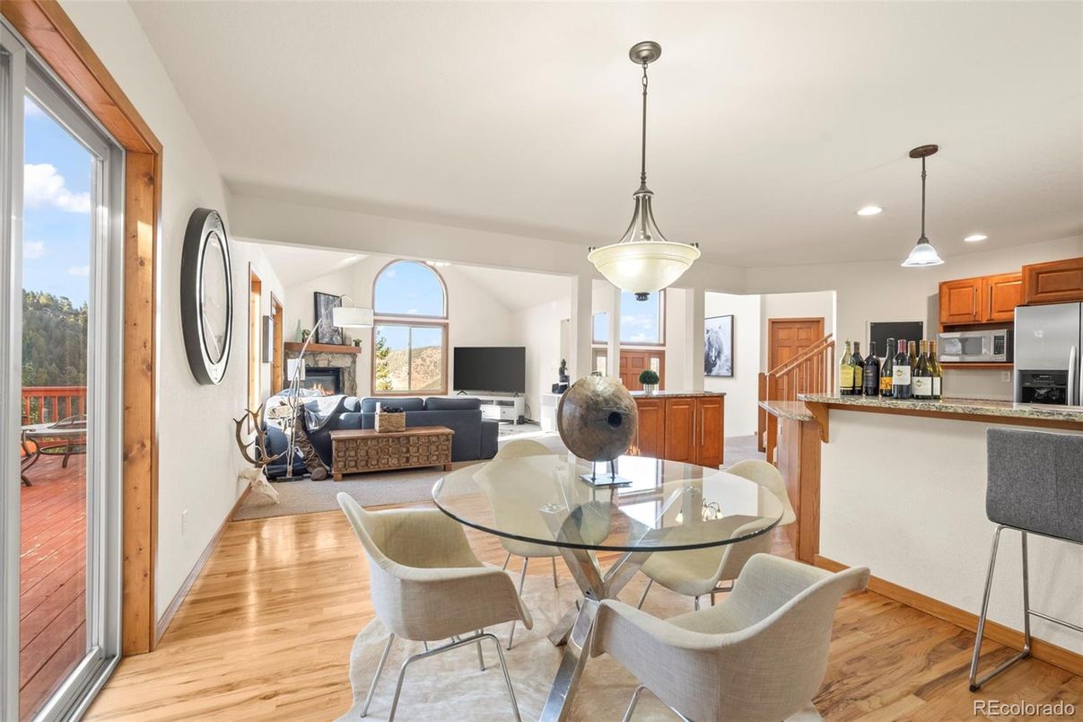 Dining room, Fireplace, Interior, Kitchen, Living room, Pendant Lights, Recessed Lighting, Stainless Steel Appliances, Wood Texture Flooring