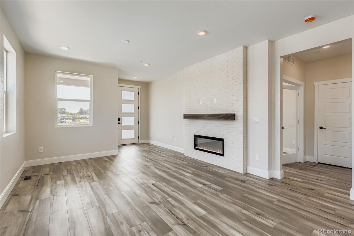 Empty room, Fireplace, Interior, Recessed Lighting, Wood Texture Flooring