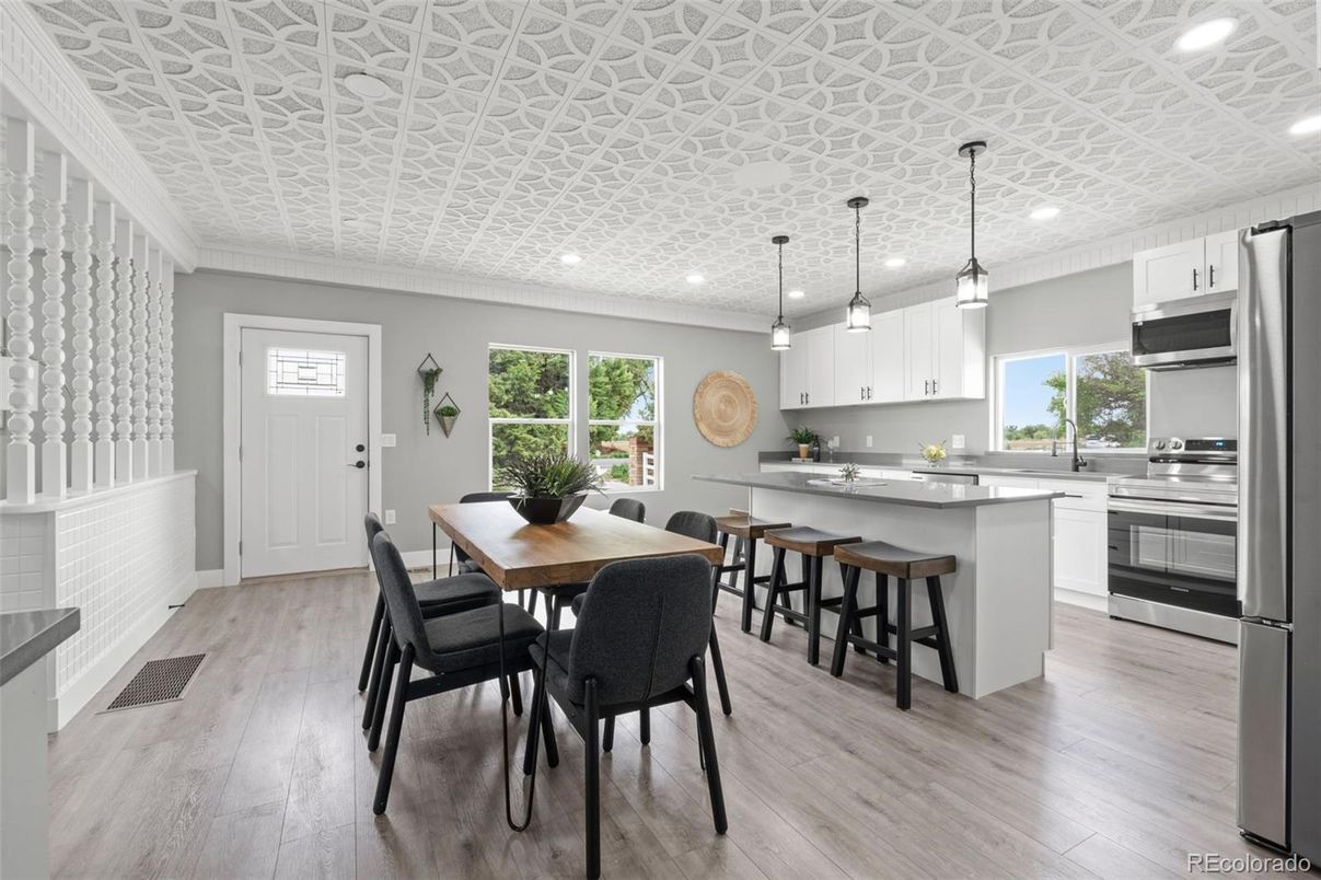Dining room, Interior, Kitchen, Pendant Lights, Recessed Lighting, Stainless Steel Appliances, Wood Texture Flooring