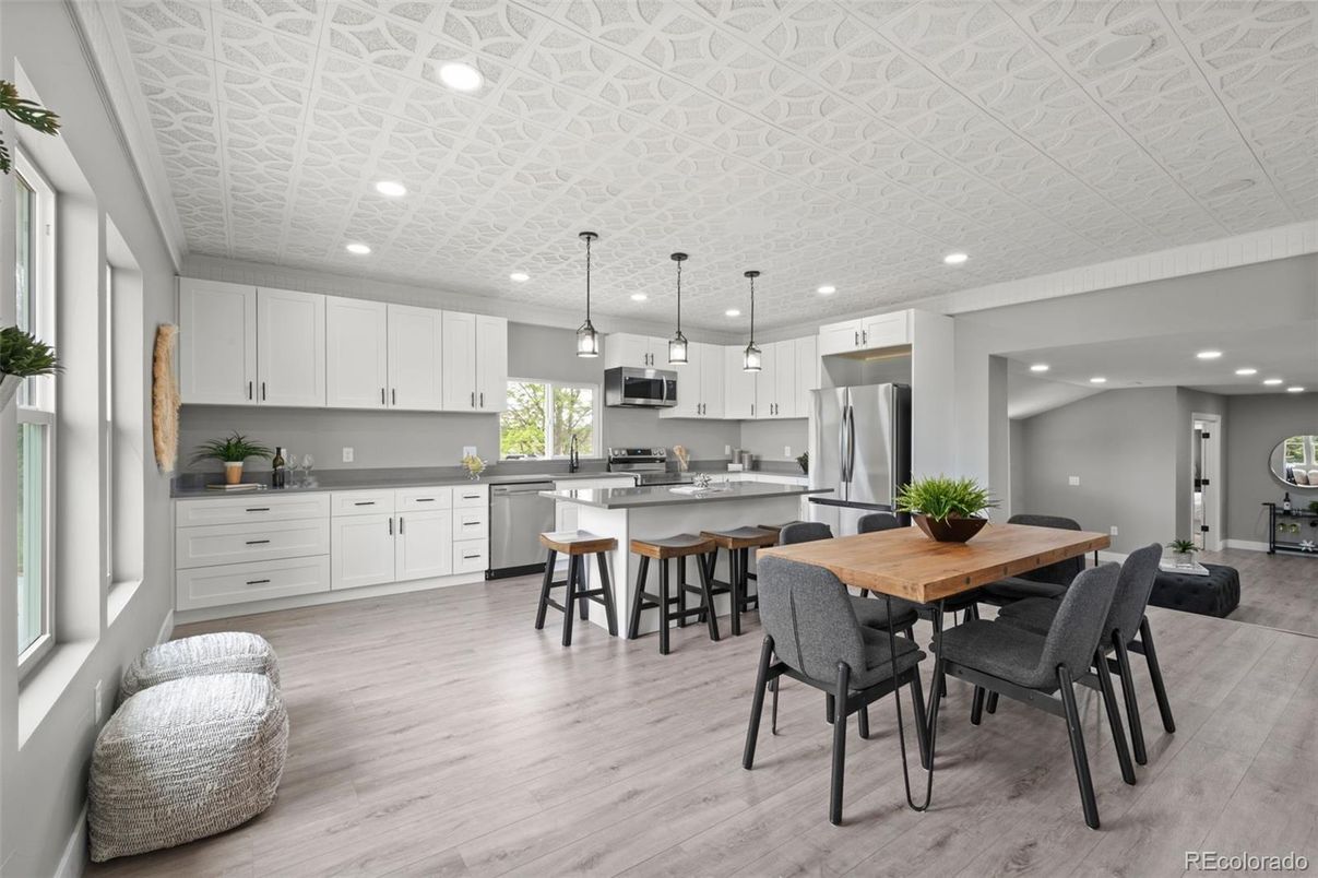 Dining room, Interior, Kitchen, Pendant Lights, Recessed Lighting, Stainless Steel Appliances, Wood Texture Flooring