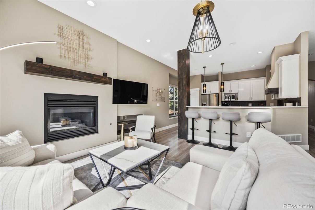 Fireplace, Interior, Kitchen, Living room, Pendant Lights, Recessed Lighting, Stainless Steel Appliances, Wood Texture Flooring