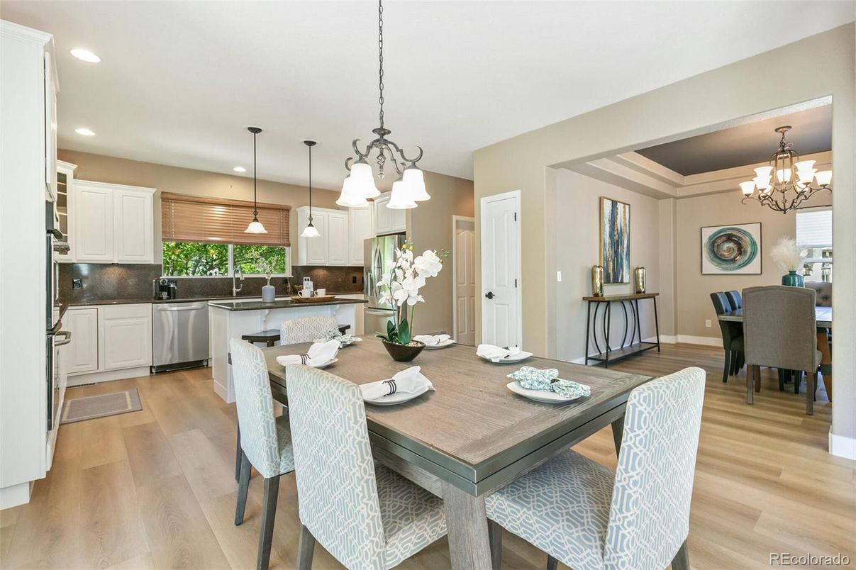 Chandelier, Dining room, Interior, Kitchen, Pendant Lights, Recessed Lighting, Stainless Steel Appliances, Wood Texture Flooring