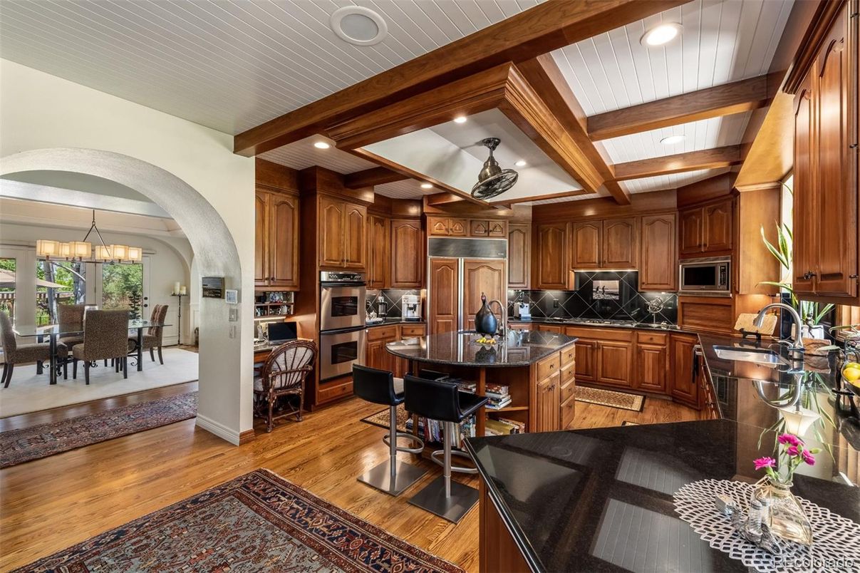 Chandelier, Dining room, Interior, Kitchen, Recessed Lighting, Stainless Steel Appliances, Wooden Beams, Wood Texture Flooring