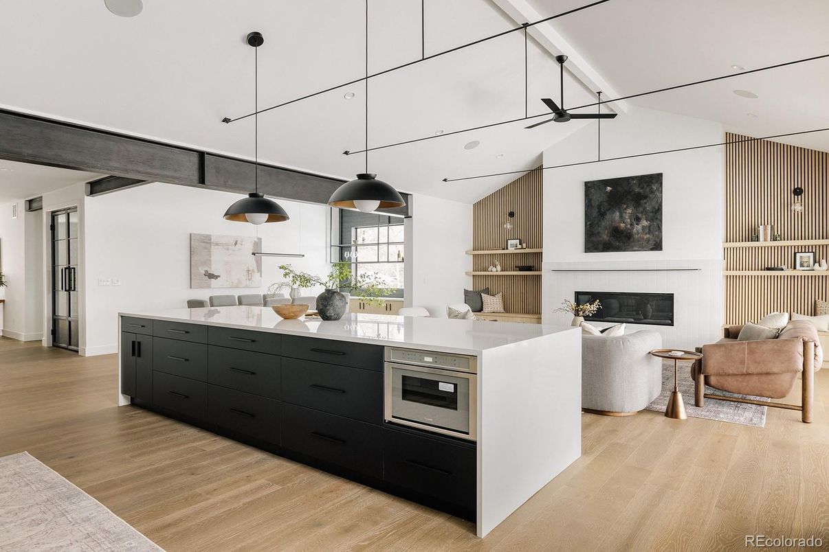 Fireplace, Interior, Kitchen, Living room, Pendant Lights, Stainless Steel Appliances, Wood Texture Flooring