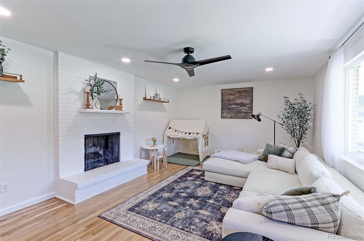 Fireplace, Interior, Living room, Recessed Lighting, Stone Walls, Wood Texture Flooring