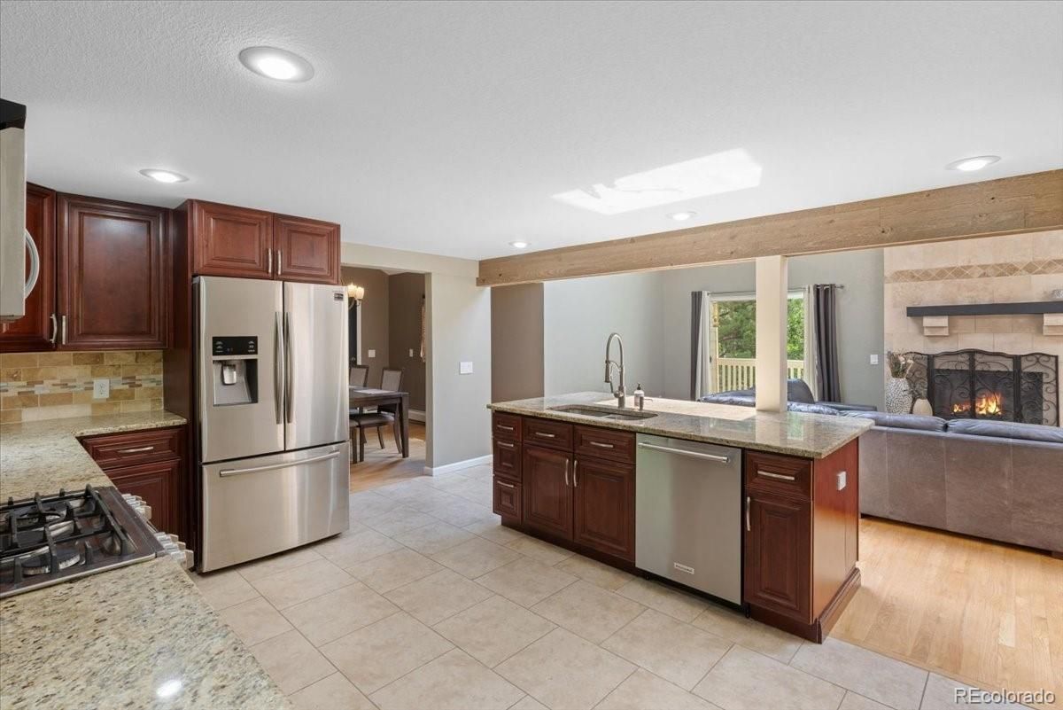 Fireplace, Interior, Kitchen, Living room, Recessed Lighting, Stainless Steel Appliances, Wood Texture Flooring