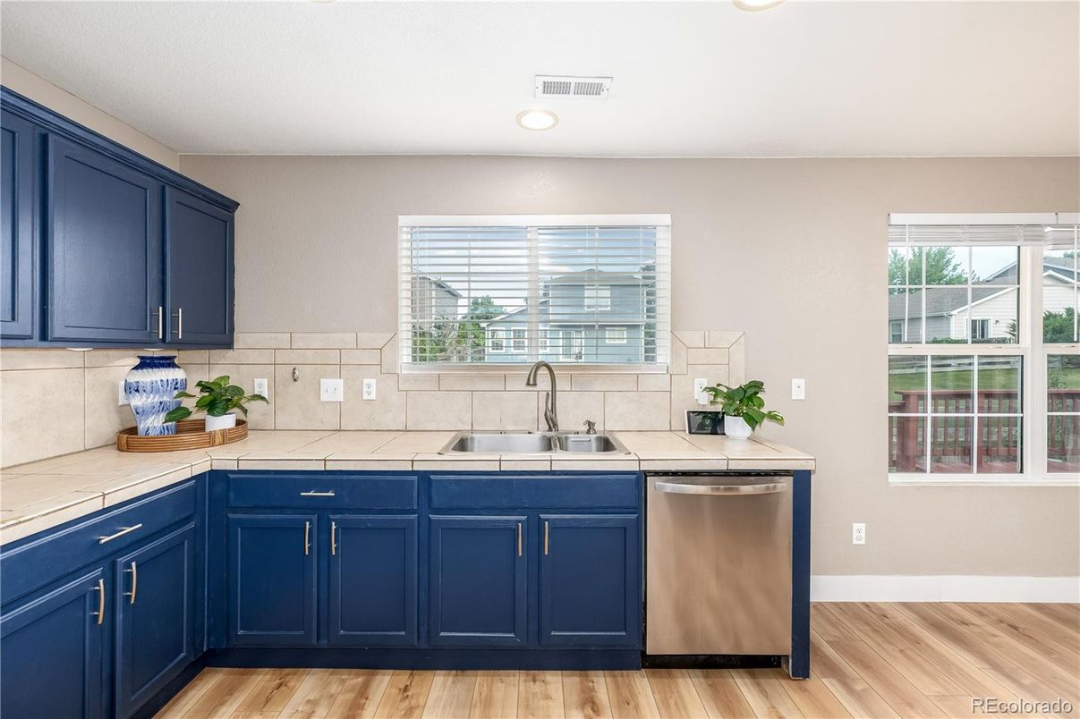 Interior, Kitchen, Recessed Lighting, Tile Countertops, Wood Texture Flooring