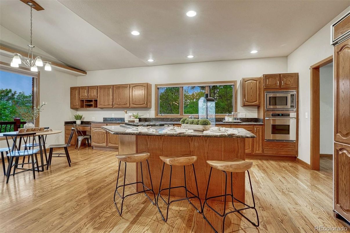 Dining room, Interior, Kitchen, Pendant Lights, Recessed Lighting, Stainless Steel Appliances, Wood Texture Flooring
