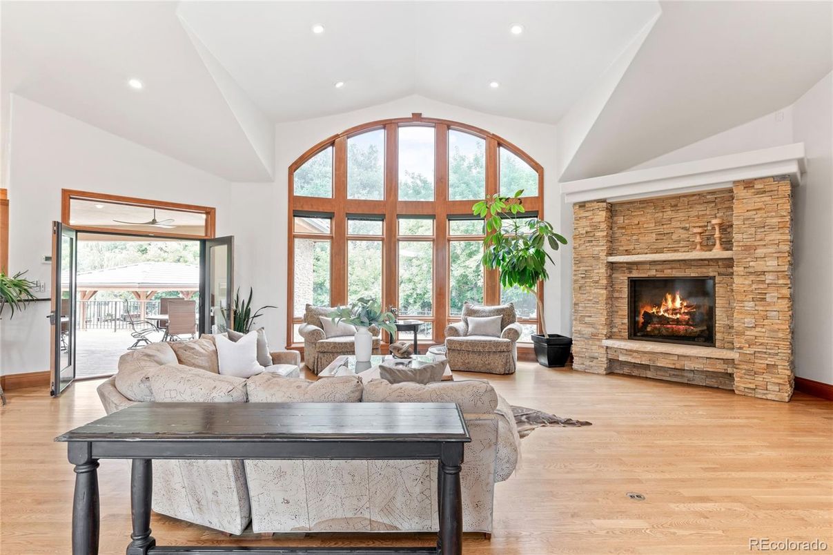 Fireplace, Interior, Living room, Recessed Lighting, Stone Walls, Wood Texture Flooring