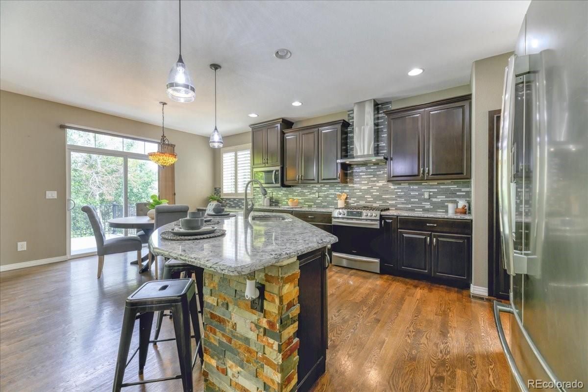 Dining room, Interior, Kitchen, Pendant Lights, Recessed Lighting, Stainless Steel Appliances, Wood Texture Flooring