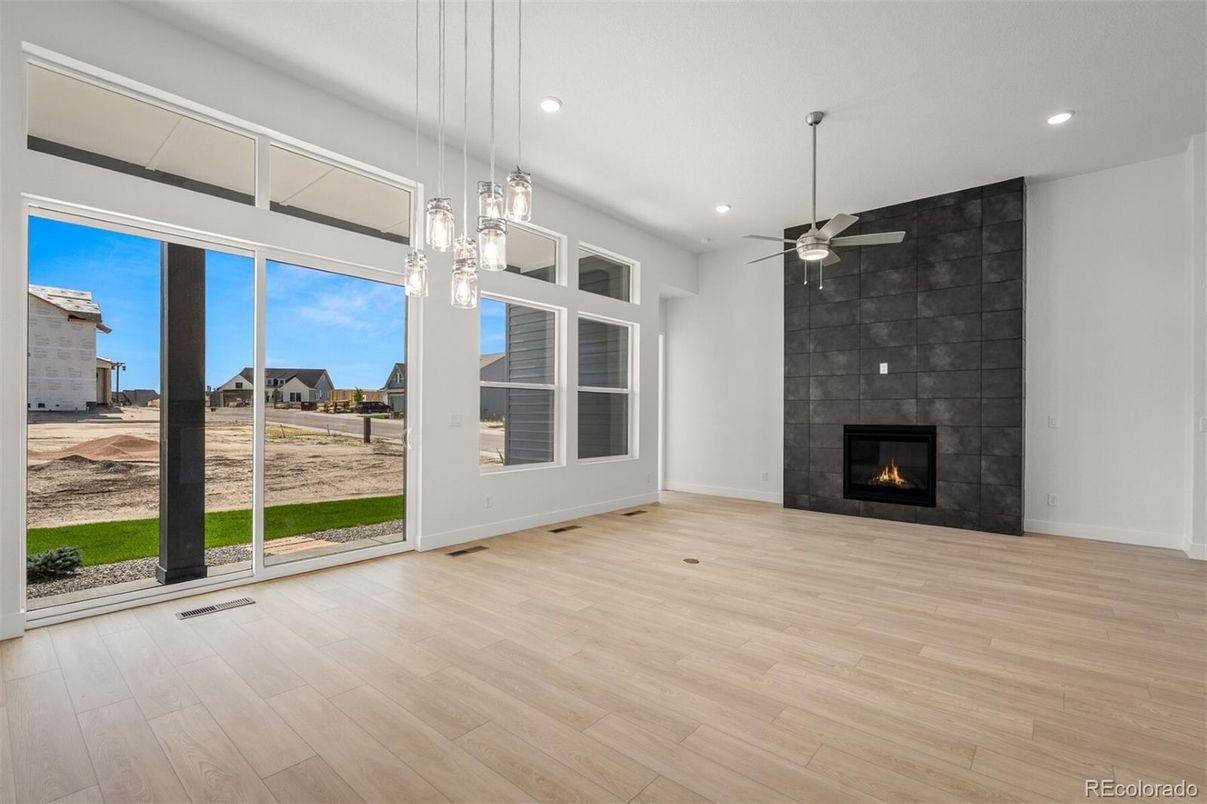 Empty room, Fireplace, Interior, Pendant Lights, Recessed Lighting, Wood Texture Flooring