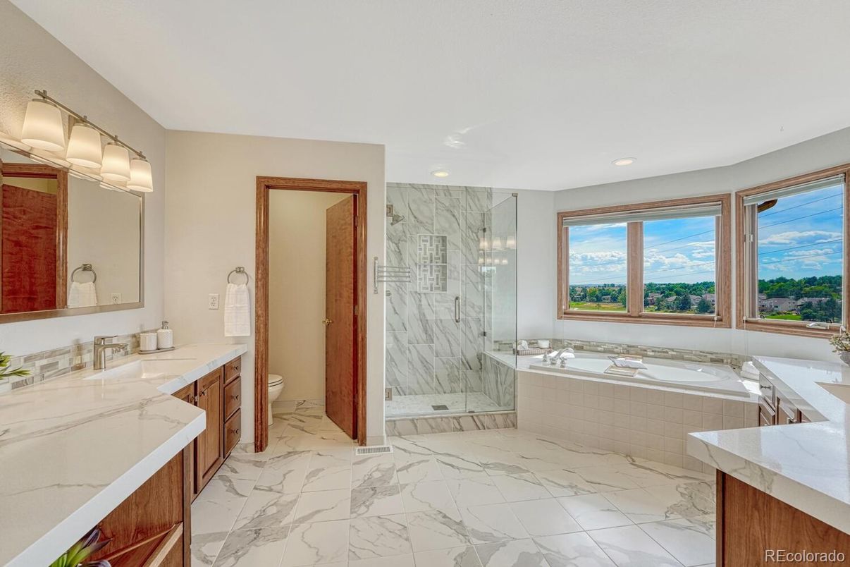 Bathroom, Dual Sink Vanities, Glass Shower, Interior, Marble, Marble Walls, Recessed Lighting