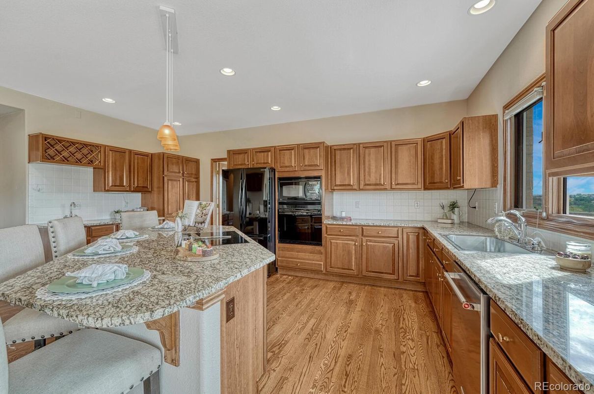 Dining room, Interior, Kitchen, Pendant Lights, Recessed Lighting, Stainless Steel Appliances, Wood Texture Flooring