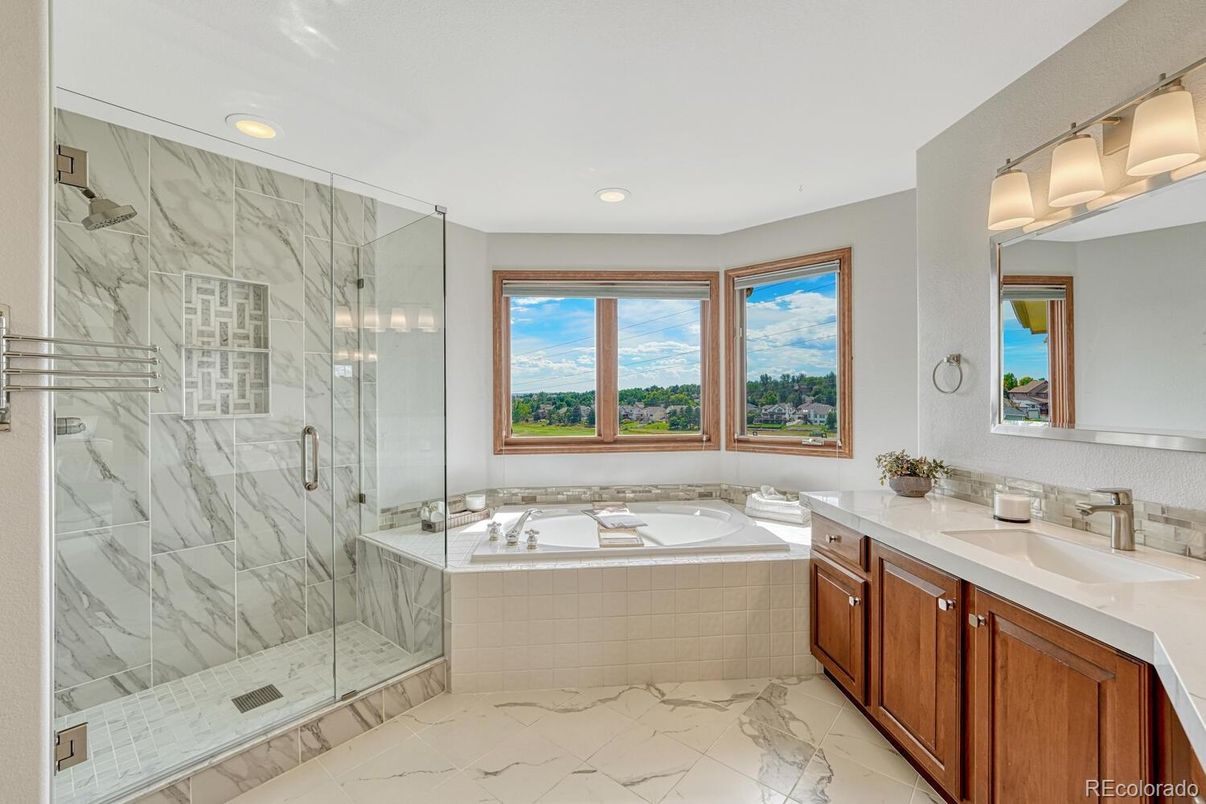 Bathroom, Dual Sink Vanities, Glass Shower, Interior, Marble, Marble Walls, Recessed Lighting