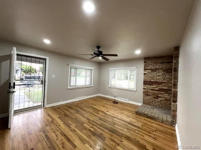 Empty room, Fireplace, Interior, Recessed Lighting, Stone Walls, Wood Texture Flooring