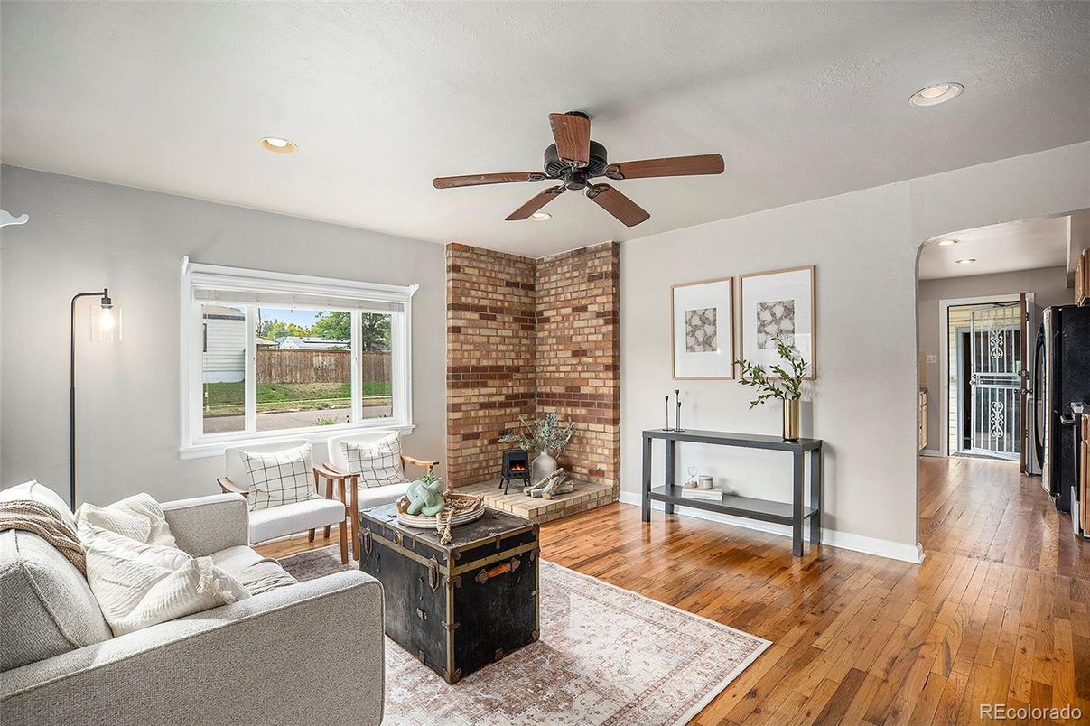 Fireplace, Interior, Living room, Recessed Lighting, Stone Walls, Wood Texture Flooring
