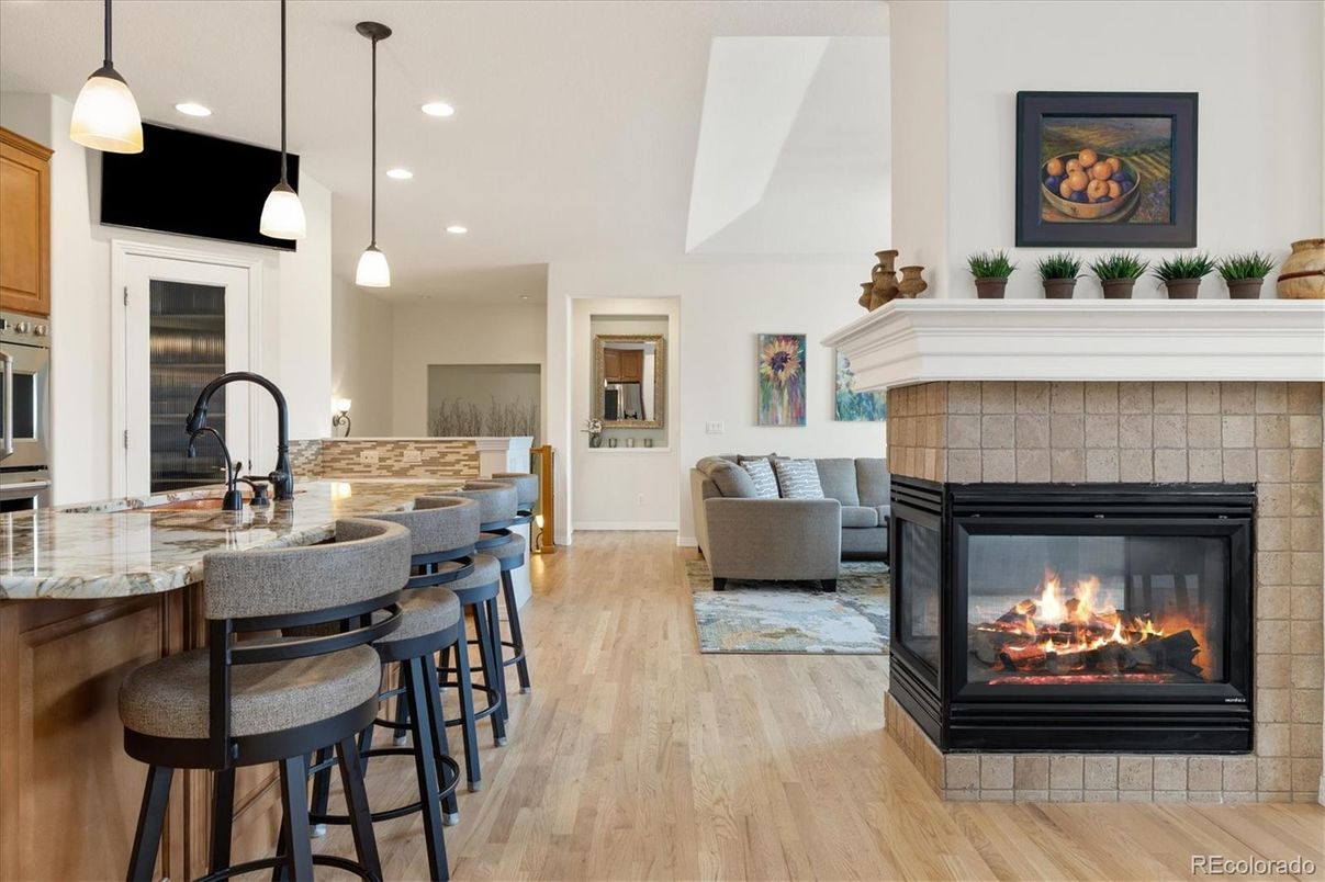 Fireplace, Interior, Kitchen, Living room, Pendant Lights, Recessed Lighting, Stainless Steel Appliances, Wood Texture Flooring
