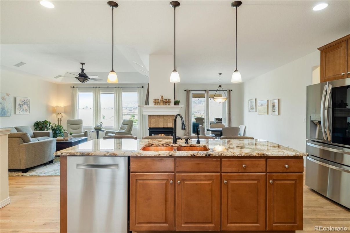Dining room, Fireplace, Interior, Kitchen, Living room, Pendant Lights, Recessed Lighting, Stainless Steel Appliances, Wood Texture Flooring
