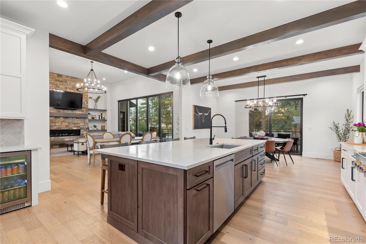 Chandelier, Dining room, Fireplace, Interior, Kitchen, Living room, Pendant Lights, Recessed Lighting, Wooden Beams, Wood Texture Flooring