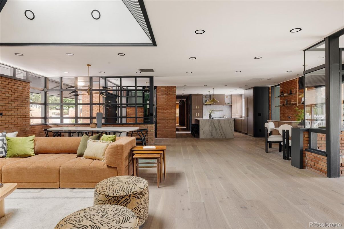 Dining room, Interior, Kitchen, Living room, Recessed Lighting, Stainless Steel Appliances, Stone Walls, Wood Texture Flooring