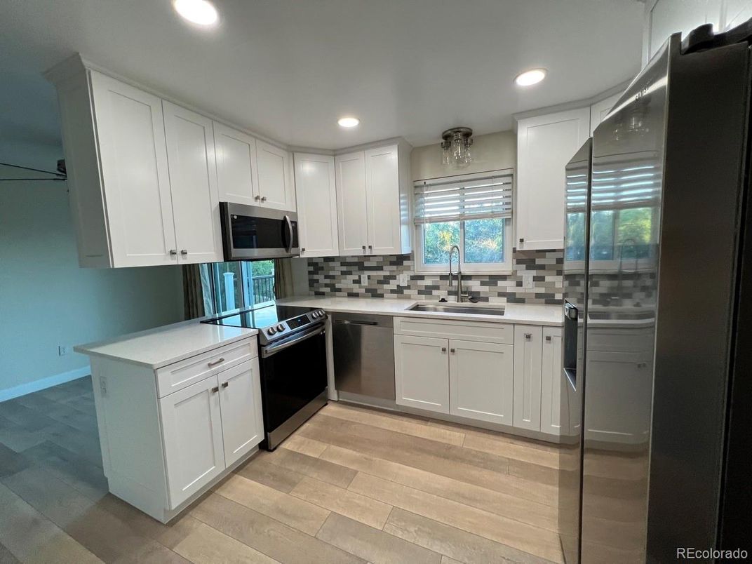 Interior, Kitchen, Recessed Lighting, Stainless Steel Appliances, Wood Texture Flooring
