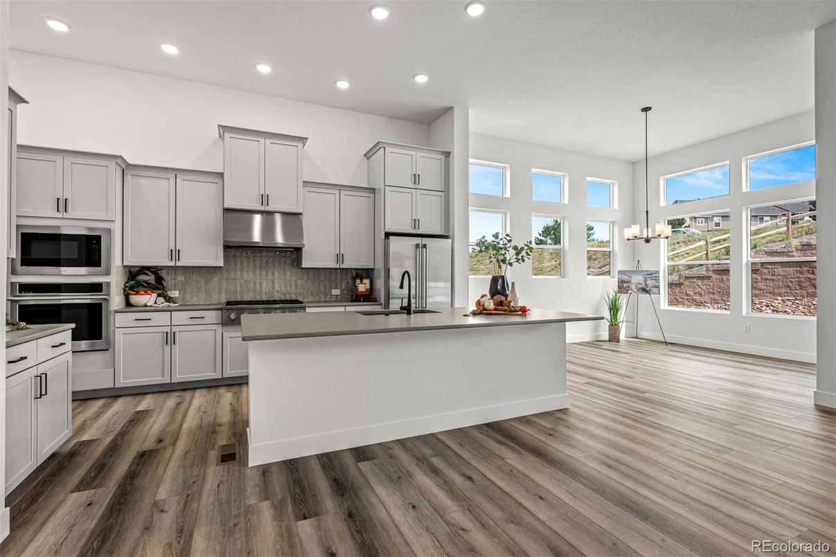 Chandelier, Interior, Kitchen, Pendant Lights, Recessed Lighting, Stainless Steel Appliances, Wood Texture Flooring