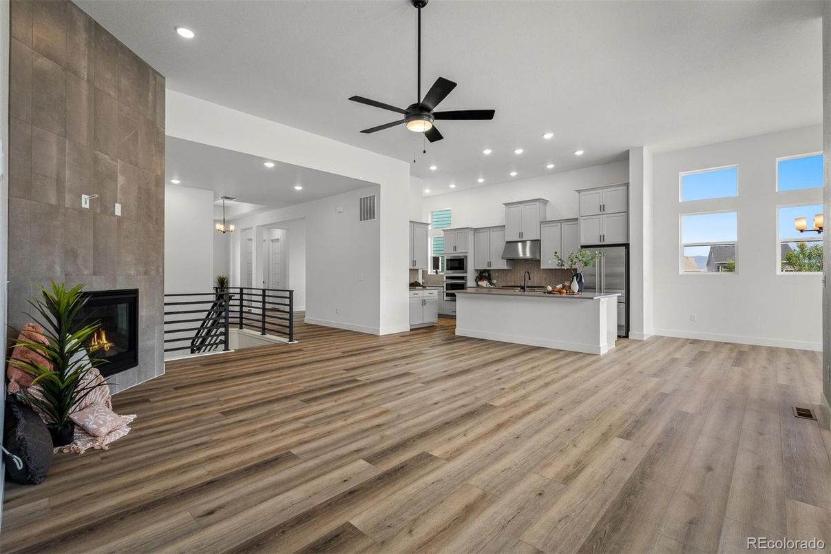 Fireplace, Interior, Kitchen, Recessed Lighting, Stainless Steel Appliances, Wood Texture Flooring