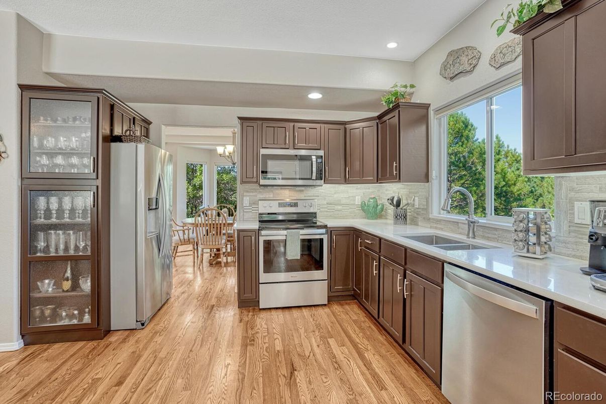 Dining room, Interior, Kitchen, Recessed Lighting, Stainless Steel Appliances, Wood Texture Flooring
