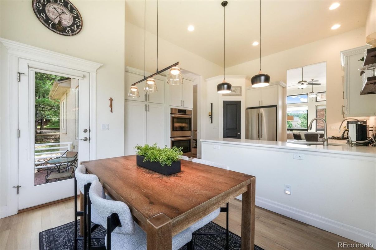 Dining room, Interior, Kitchen, Pendant Lights, Recessed Lighting, Stainless Steel Appliances, Wood Texture Flooring