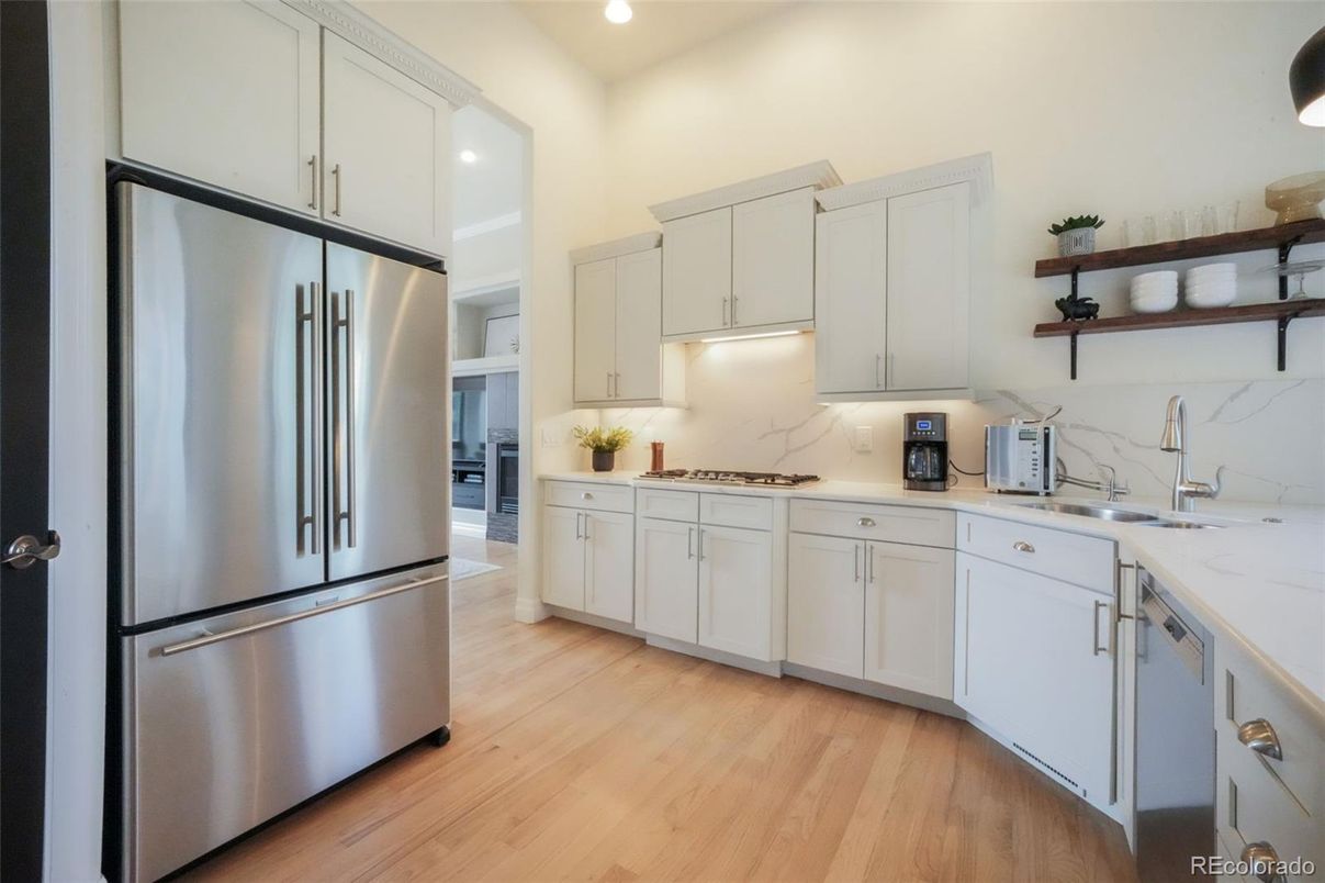 Interior, Kitchen, Marble Walls, Recessed Lighting, Stainless Steel Appliances, Wood Texture Flooring